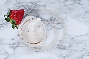 One Scoop of Strawberry Ice Cream with Single Strawberry