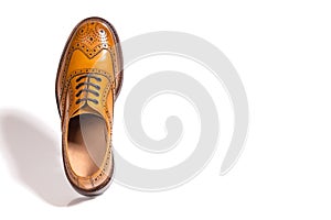 One Separate Male Tan Brogue Oxford Shoe. Isolated