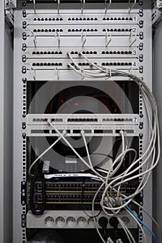 In one server rack are many patch panels and network cables and network switches