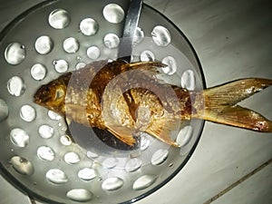 One serving of fried fish on a wok