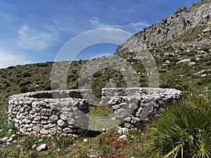 One of the several Stone circular Animal Shelters found on the slopes beneath El Torcal in Andalucia. photo