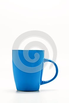 One shabby blue cup isolated on a white background