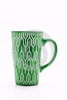 One shabby green cup isolated on a white background