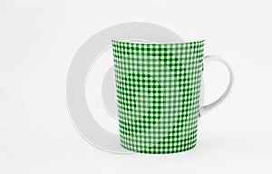 One shabby green cup isolated on a white background