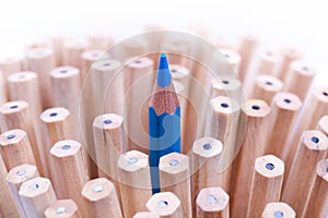 One sharpened blue pencil among many ones