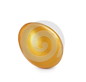 One shiny golden egg isolated on white