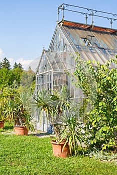 One side of the greenhouse building at the Tivoli Park in Ljubljana, Slovenia, in a clear summer day