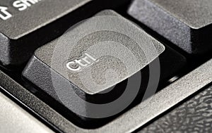 One single control key ctrl button on a simple desktop PC black office keyboard, object macro, extreme closeup detail, nobody
