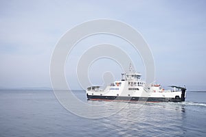 Ferry on own one single minimal open sea ocean bright light summer island tourism photo