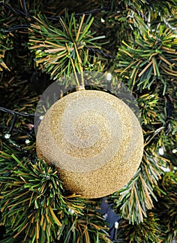 One Single golden ball for Christmas tree decoration.