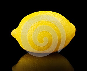 One single lemon isolated on black