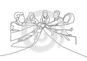 One single line drawing group of young happy male and female business people unite their hands together to form a circle shape