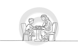One single line drawing of young Arabian father and son seriously playing chess together at home vector illustration. Happy
