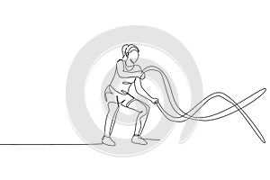 One single line drawing of young energetic woman exercise with battle rope in gym fitness center vector illustration graphic.