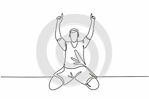 One single line drawing of young football player pointing his fingers to the sky celebrating his goal scoring at field. Match goal