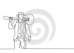 One single line drawing of young happy male guitarist standing while put the guitar on his shoulder. Trendy musician artist