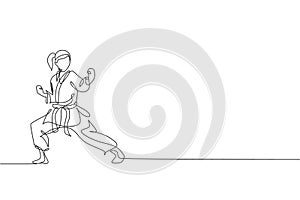 One single line drawing of young sporty karateka girl in fight uniform with belt exercising martial art at gym vector illustration