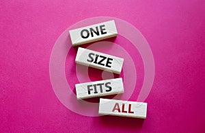 One size fits all symbol. Concept words One size fits all on wooden blocks. Beautiful red background. Business and One size fits