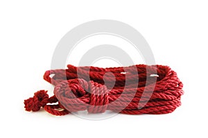 One skein of jute rope six millimeters for Japanese bondage and shibari, painted in red on a white background