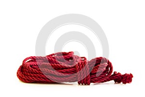 One skein of jute rope six millimeters for Japanese bondage and shibari, painted in red on a white background