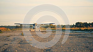 One small airplane going fast on a runway to take off.