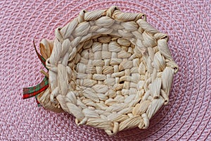 One small decorative brown wicker decorative bowl basket