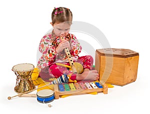 One small little girl playing music.