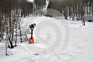 One snow cannon in mountains