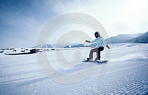 One snowboarder snowboarding