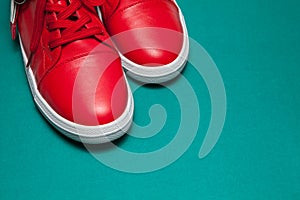 One sport red sneakers on blue background