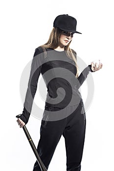 One Sportive Caucasian Female Baseball Player Athlete Holding Ball with Bat wearing Sport Outfit Against Pure White background