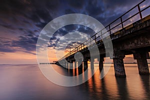 Sunset at barombong pier Makassar photo