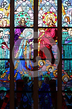 One of the stained-glass windows of the Immaculate chapel in Nantes, France, represents the crowning of the Virgin by the Christ photo