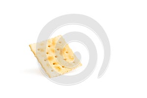One standing quare cracker biscuit on a white background