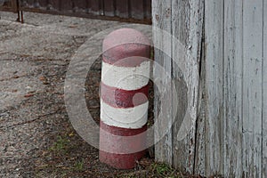 One striped iron red white pole