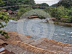 One Suspension bridge over Lau Bohorok river, Bukit Lawang Sumatra, Indonesia