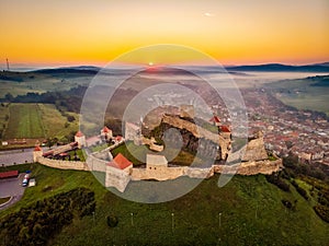 One of the symbols of Romania the Rupea Fortress in Transylvania. Aerial landscape at sunrise