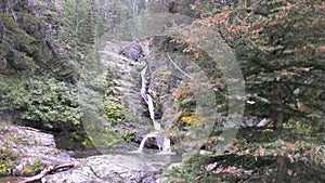 One of the taller waterfalls leading to Lake McDonald. photo