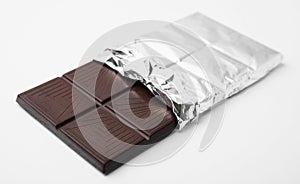 One tasty chocolate bar on white background