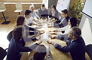 Multiracial team of business people having a work meeting around an office table