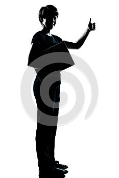 One teenager silhouette carrying laptop thumb