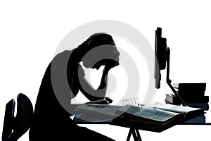 One teenager silhouette studying with computer
