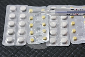 One thermometer with pills