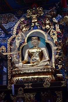 One of three golden Buddhas at Namdroling Monastery, Coorg.