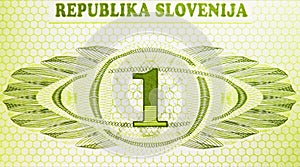 One Tolar banknote, Bank of Slovenia, closeup bill fragment shows Face value