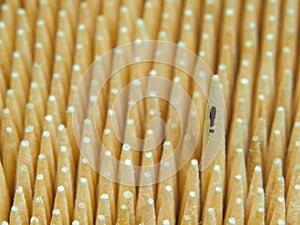 One toothpick with an exclamation mark is taller than a lot of others photo