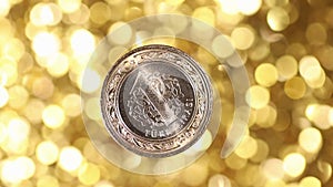 One Turkish Lira Coin Rotates On A golden Background.