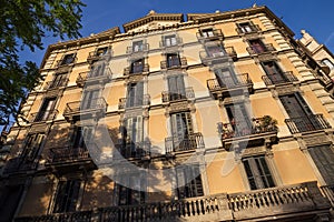 One of the typical old residential buildings in the historical center of Barcelona in sunny day. Spain