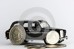 One UAE dirham on black car isolated on white background.