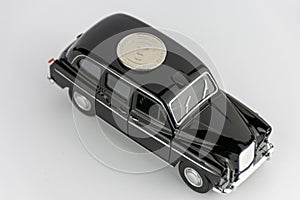 One UAE dirham on black car isolated on white background.